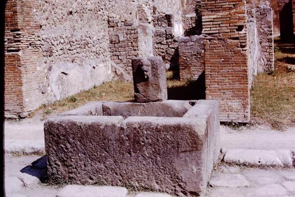 Fountain outside VII.14.13 and VII.14.14 on Via dellAbbondanza, Pompeii. 1975. Photo by Stanley A. Jashemski.   
Source: The Wilhelmina and Stanley A. Jashemski archive in the University of Maryland Library, Special Collections (See collection page) and made available under the Creative Commons Attribution-Non Commercial License v.4. See Licence and use details. J75f0373
