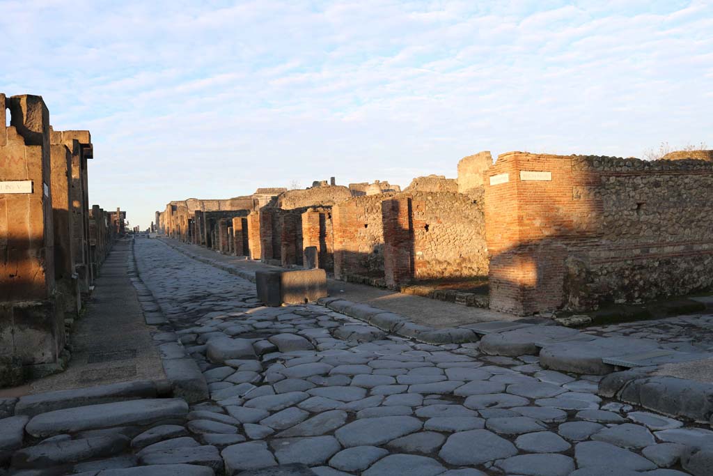 Fountain outside VII.14.13 and VII.14.14 on Via dellAbbondanza, Pompeii. December 2018. Looking west between VIII.5, on left, and VII.14, on right.
From junction with Via dei Teatri, on extreme left, and Vicolo del Lupanare, on extreme right. Photo courtesy of Aude Durand.
