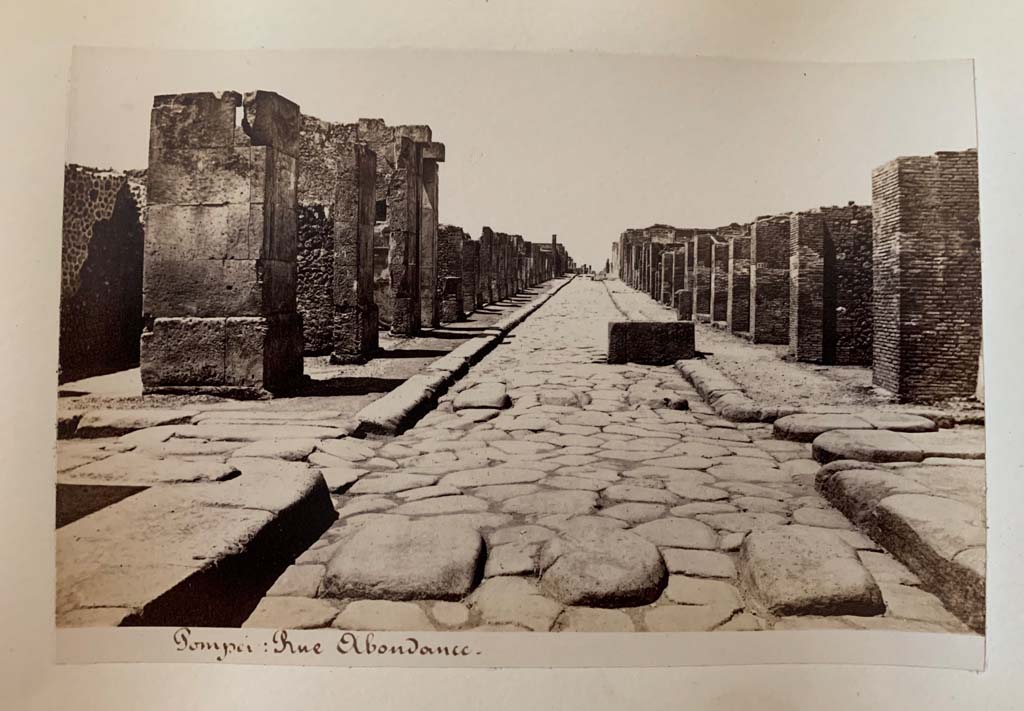 Fountain outside VII.14.13 and VII.14.14 on Via dellAbbondanza. Album by M. Amodio, c.1880, entitled Pompei, destroyed on 23 November 79, discovered in 1748.
Looking west to crossroads with Via dei Teatri, on left, and Vicolo del Lupanare, on right.
Photo courtesy of Rick Bauer.
