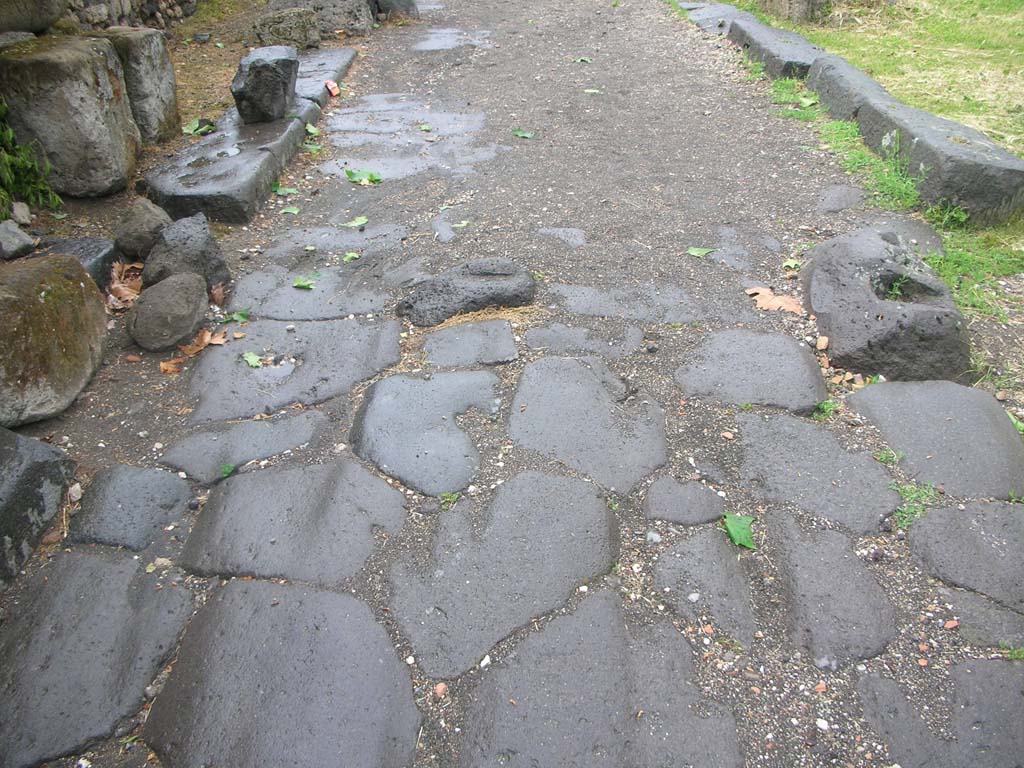 Vesuvian Gate Pompeii. May 2010. 
Looking north along roadway towards site of doorway, with small block of lava, in centre, for door to close against. Photo courtesy of Ivo van der Graaff.
See Notizie degli Scavi di Antichità, 1906, p. 97-100.

