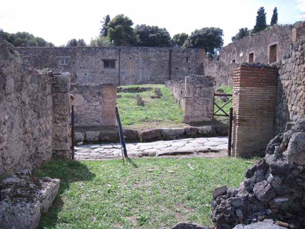 1.2.4 Pompeii. September 2010. Looking west from rear of shop, towards doorway and Via Stabiana. Photo courtesy of Drew Baker.
