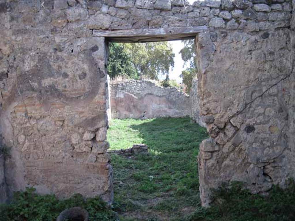 1.2.16 Pompeii. September 2010. Doorway in south wall of room 8, leading to north portico. Photo courtesy of Drew Baker.
