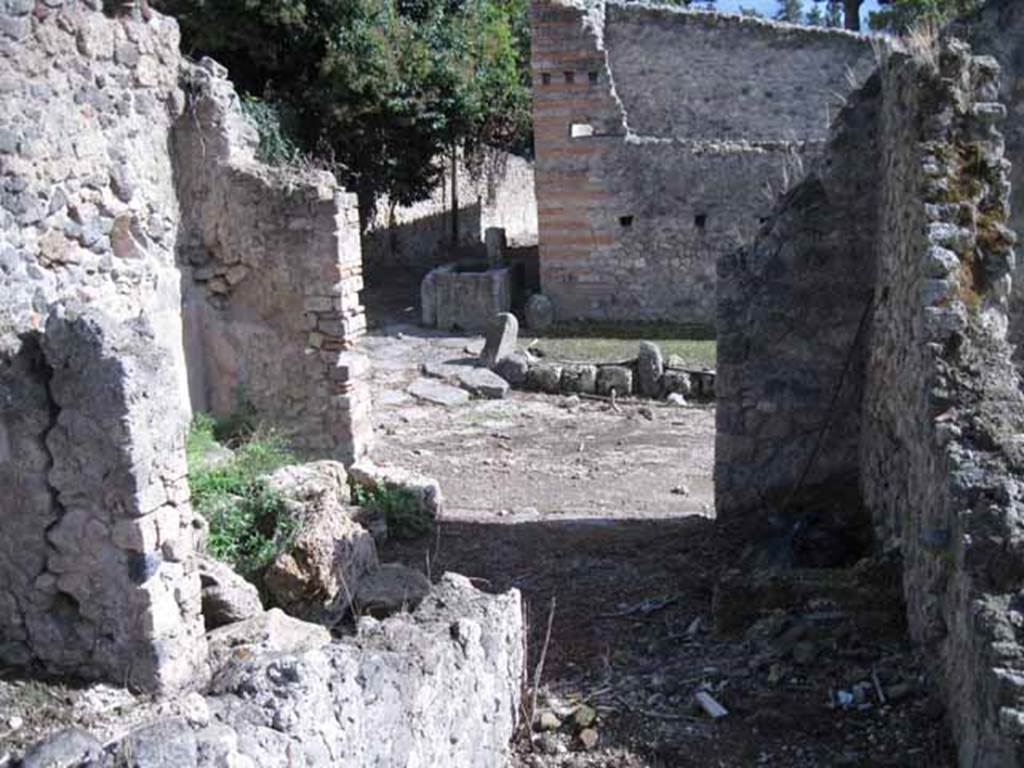 I.2.23 Pompeii. September 2010. Looking south to entrance doorway on Vicolo del Conciapelle, from rear of corridor. Photo courtesy of Drew Baker.

