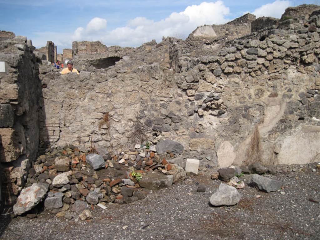 I.3.1 Pompeii. September 2010. North wall of bakery shop, and detail of north-west corner. Photo courtesy of Drew Baker. According to Fiorelli, a wooden stepladder was against the wall to the left of the doorway, it led to the upper floor. See Pappalardo, U., 2001. La Descrizione di Pompei per Giuseppe Fiorelli (1875). Napoli: Massa Editore. (p.38)
