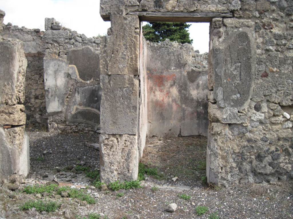 I.3.8b Pompeii. September 2010. East wall of tablinum with two doorways. Photo courtesy of Drew Baker.
