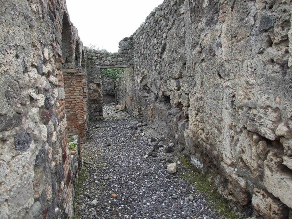 I.3.8b Pompeii. December 2006. Looking south along walkway behind arches on west side of peristyle.