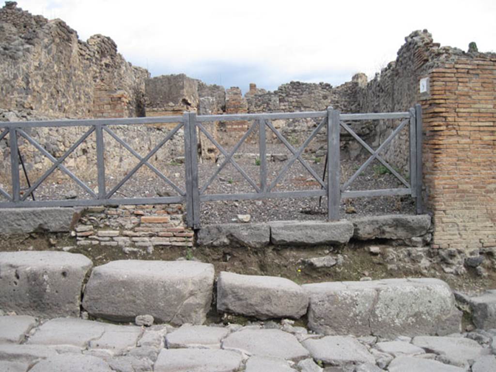 .3.9 Pompeii. September 2010. Looking east across Via Stabiana towards the entrance doorway.  The main shop room at the rear of the doorway on the right, would have connected with the rooms in I.3.10. Photo courtesy of Drew Baker.
