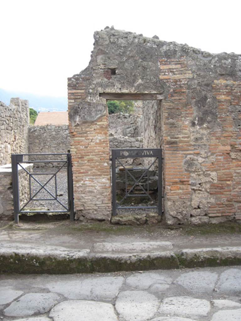I.3.21 Pompeii. September 2010. Looking south to entrance doorway on Vicolo del Menandro, on right. Photo courtesy of Drew Baker.
