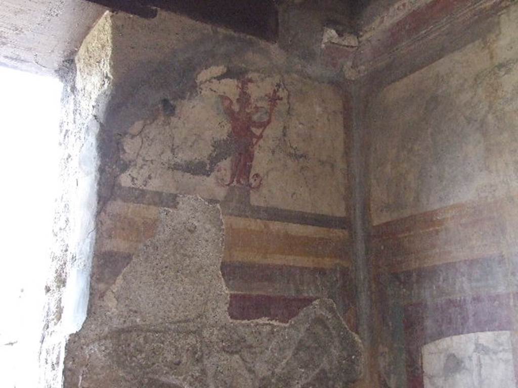 I.3.25 Pompeii. December 2006. Oecus, with detail of wall painting of (Egyptian?) deity in north-east corner.