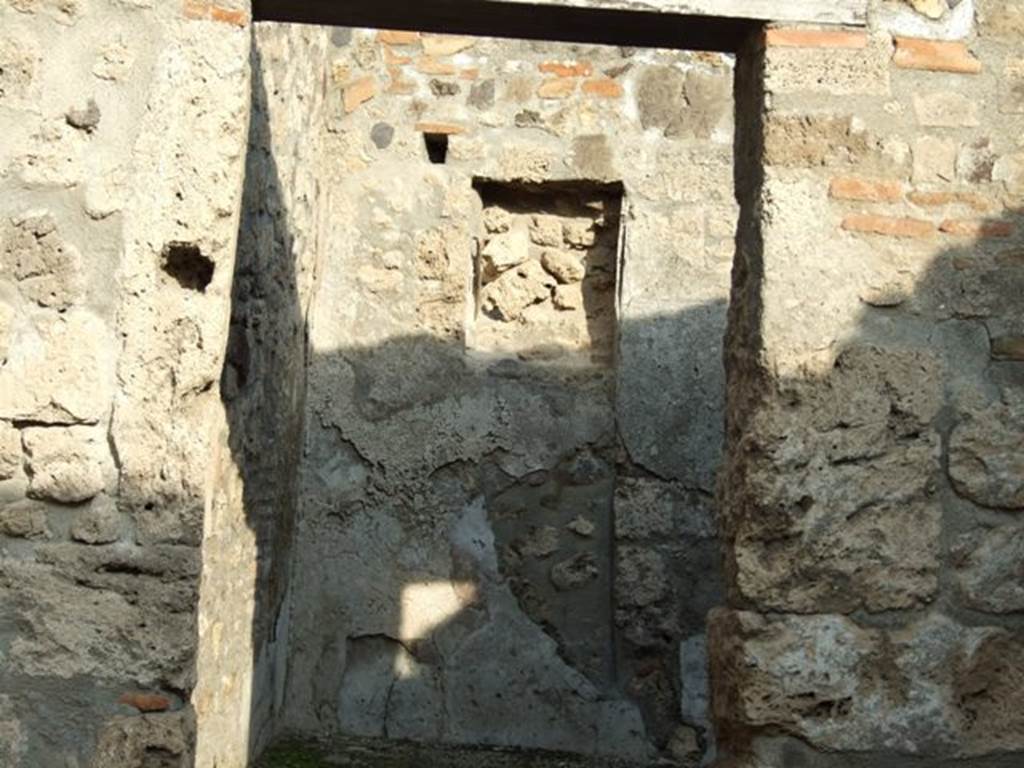 I.4.4 Pompeii. December 2007. Doorway into rear room that contained a small hearth and staircase to upper floor. See Eschebach, L., 1993. Gebudeverzeichnis und Stadtplan der antiken Stadt Pompeji. Kln: Bhlau. (p.26).
