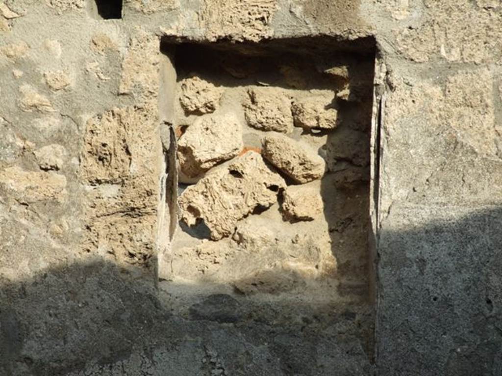 I.4.4 Pompeii. December 2007. Niche or recess in east wall of rear room.
