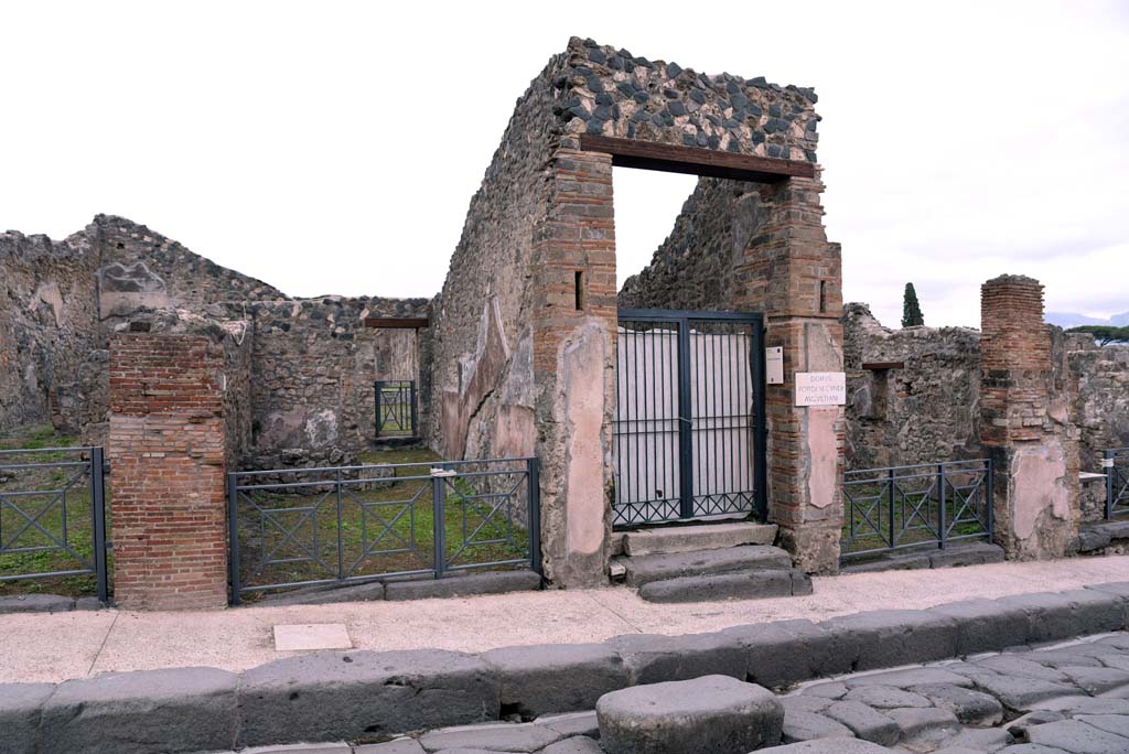 I.4.6, centre left, I.4.5, in centre, and I.4.4, centre right, Pompeii. October 2019. Looking east towards entrance doorways. 
Foto Tobias Busen, ERC Grant 681269 DCOR.
