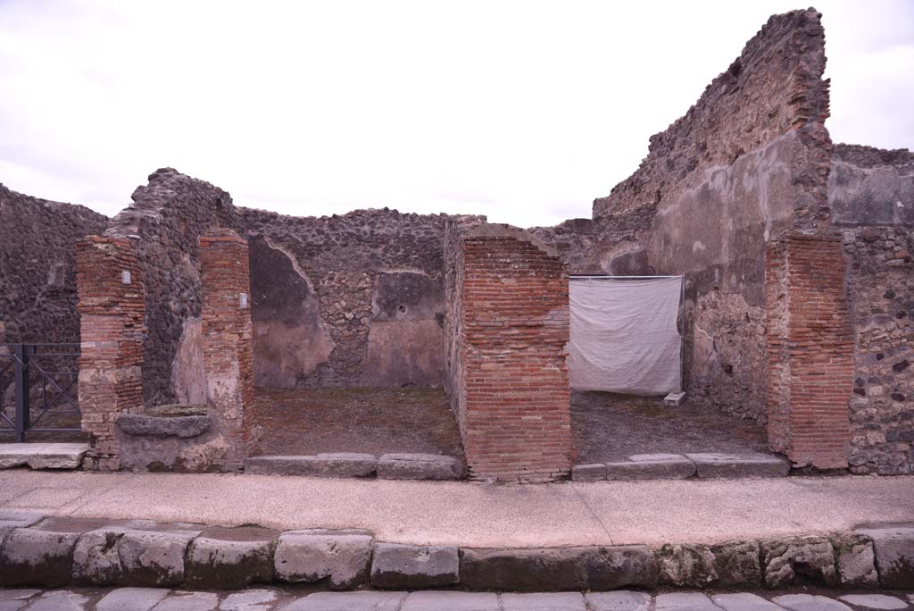 I.4.21, on left, with I.4.20, centre left, and I.4.19, on right, Pompeii. October 2019. 
Entrance doorways on south side of Via dellAbbondanza.
Foto Tobias Busen, ERC Grant 681269 DCOR.

