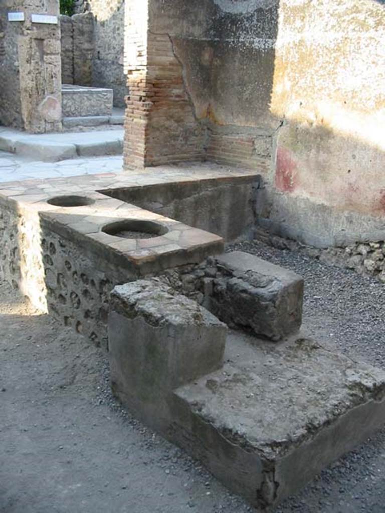 I.4.27 Pompeii. May 2003.  Rear of hearth, looking to front of bar or sales-room.
Photo courtesy of Nicolas Monteix.


