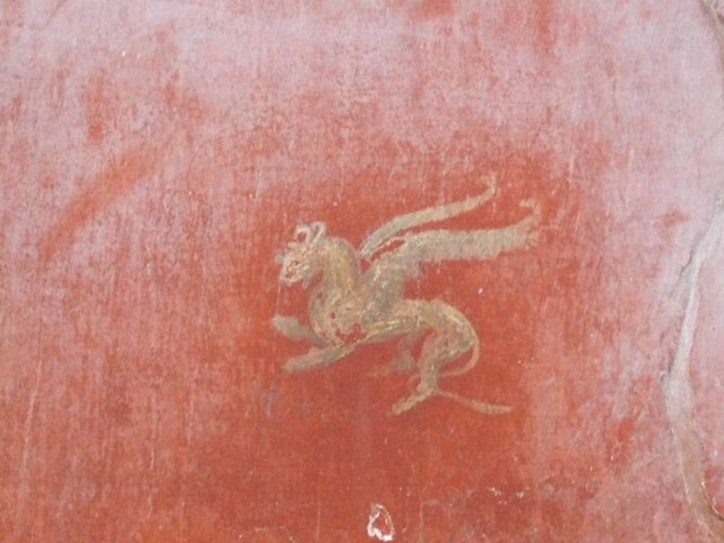 I.6.7 Pompeii. September 2019. 
Detail of painted decoration in centre of panel on south wall on west side of doorway in south-east corner of atrium.
Photo courtesy of Klaus Heese.
