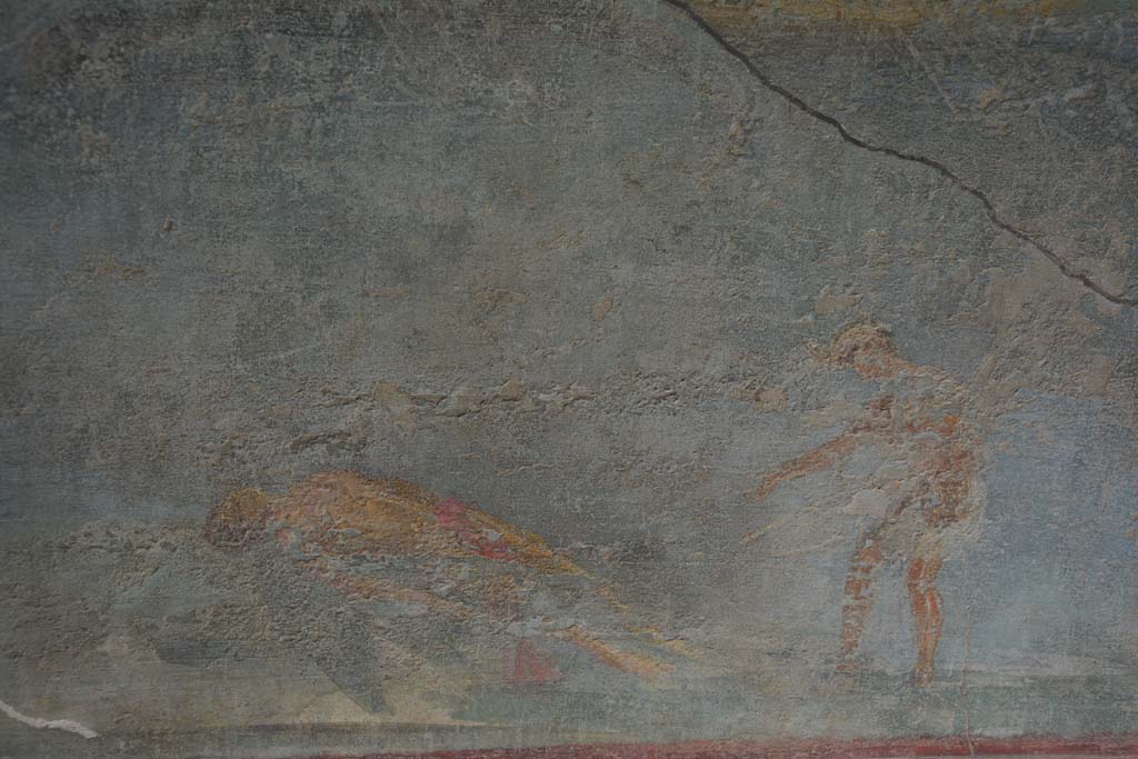 I.7.7 Pompeii. October 2019. Detail from central painting on east wall showing the dead body of Icarus retrieved by a fisherman.
Foto Annette Haug, ERC Grant 681269 DCOR.

