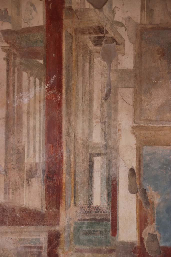 I.7.11 Pompeii. September 2021. Painted decoration in centre panel of north wall. Photo courtesy of Klaus Heese.