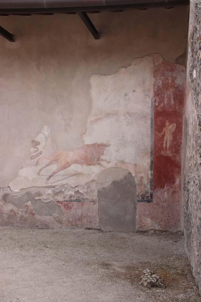 I.7.12 Pompeii. December 2006. South-west corner of garden, with wall painting on west side of nymphaeum. On the west end of the south wall, was a figure of a statue of a naked armed warrior.

