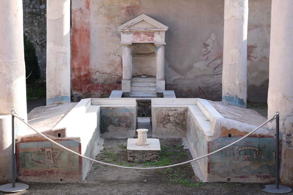 I.7.12 Pompeii. December 2018. 
Looking south across summer triclinium with painted panels towards fountain against wall at rear. Photo courtesy of Aude Durand.
