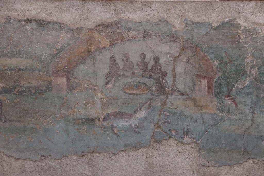 I.7.12 Pompeii. September 2021. 
Detail of painted panel on inside of west side of triclinium towards south end. Photo courtesy of Klaus Heese.
