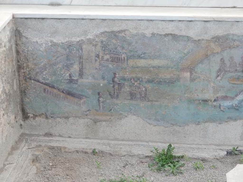 I.7.12 Pompeii. May 2017. Detail of painted panel on inside of south end of the west side of summer triclinium. Photo courtesy of Buzz Ferebee.

