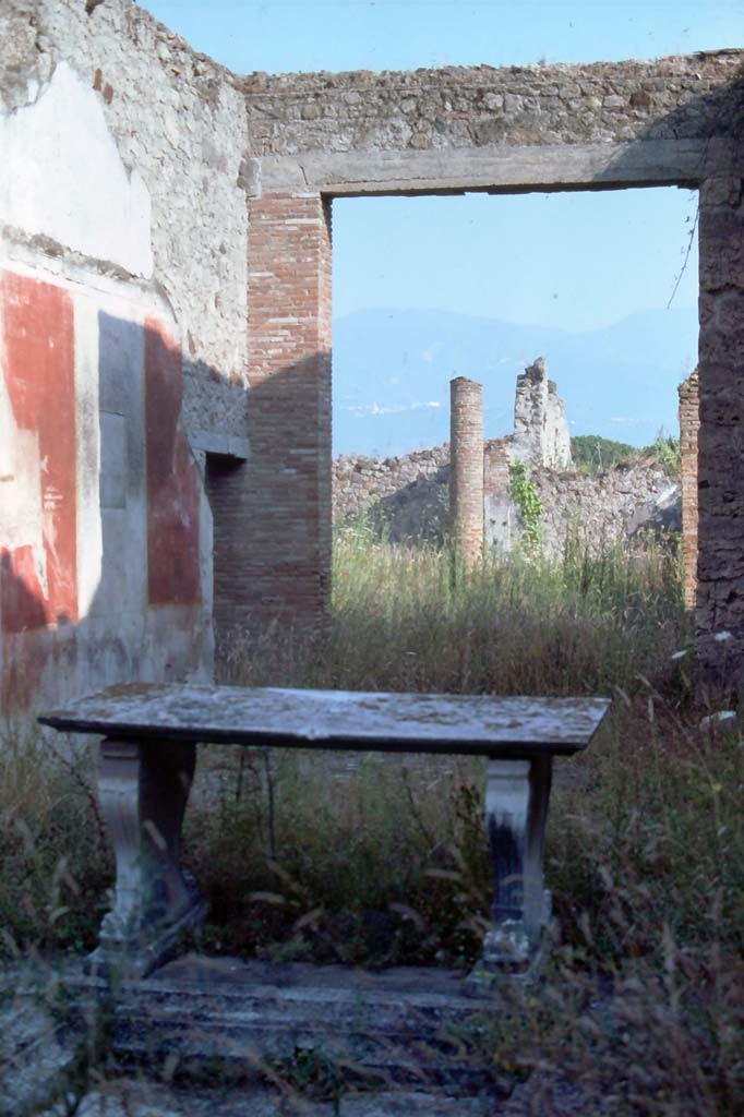 1.8.5 Pompeii. 4th December 1971. Looking across impluvium in atrium, towards east wall of tablinum.
Photo courtesy of Rick Bauer, from Dr.George Fays slides collection.
