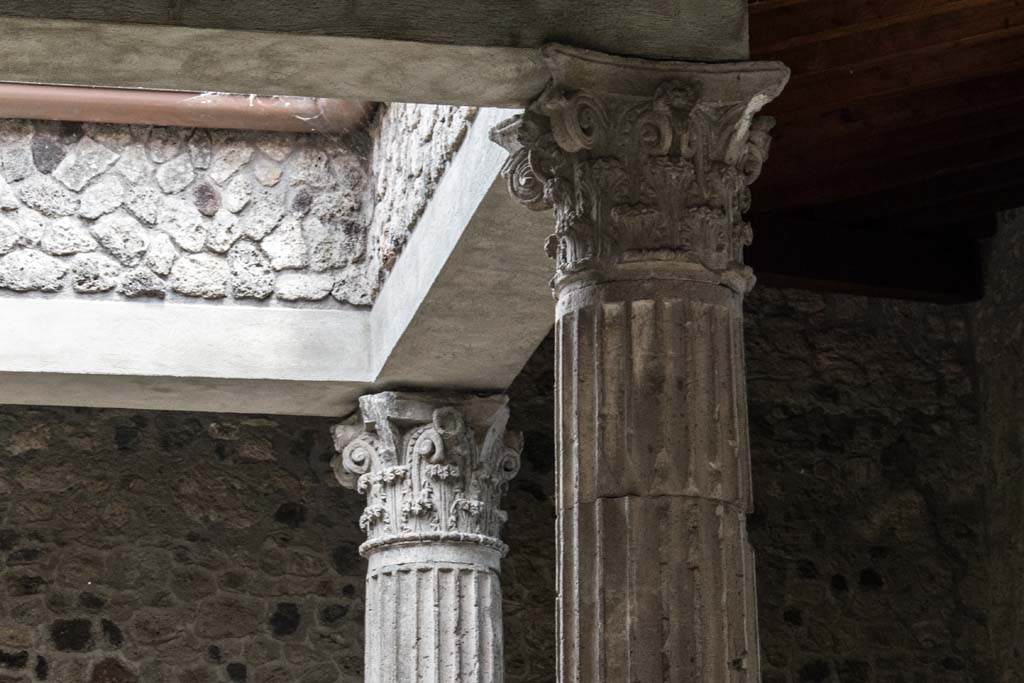 I.8.17 Pompeii June 2018. Room 3, details of capitals at top of columns near compluvium in atrium. Photo courtesy of Johannes Eber.