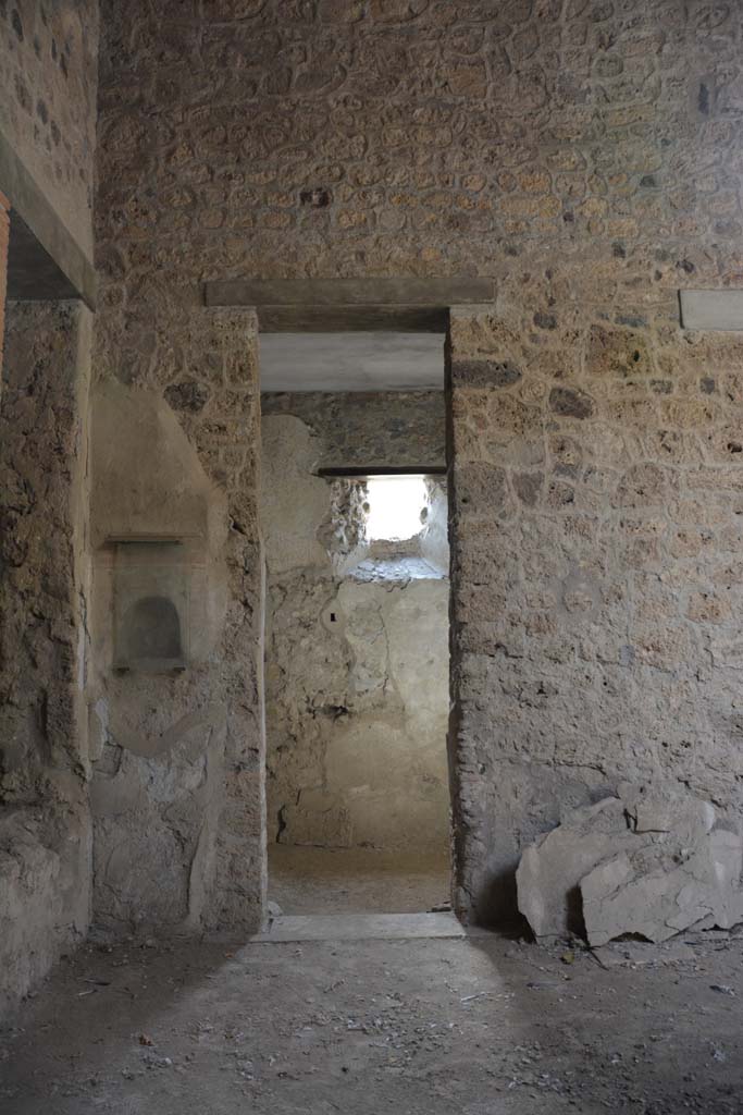 I.8.17 Pompeii. March 2019. 
Room 8, looking south to doorway in south-east corner of atrium, with niche shrine, on left.   
Foto Annette Haug, ERC Grant 681269 DCOR.
