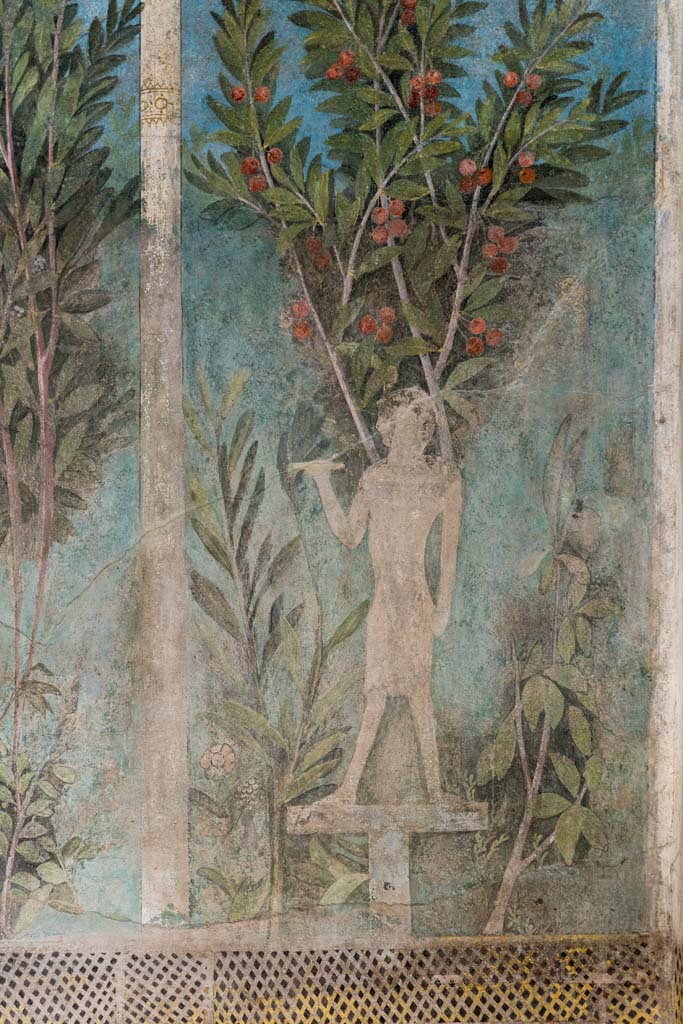 I.9.5 Pompeii. October 2022. 
Room 5, detail of painting of Egyptian pharaonic statue and cherry tree from south end of east wall of cubiculum.
Photo courtesy of Klaus Heese.
