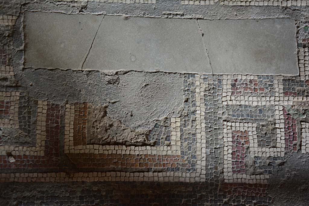 I.10.4 Pompeii. September 2019. Room 11, detail of centre of doorway threshold.  
Foto Annette Haug, ERC Grant 681269 DÉCOR.
