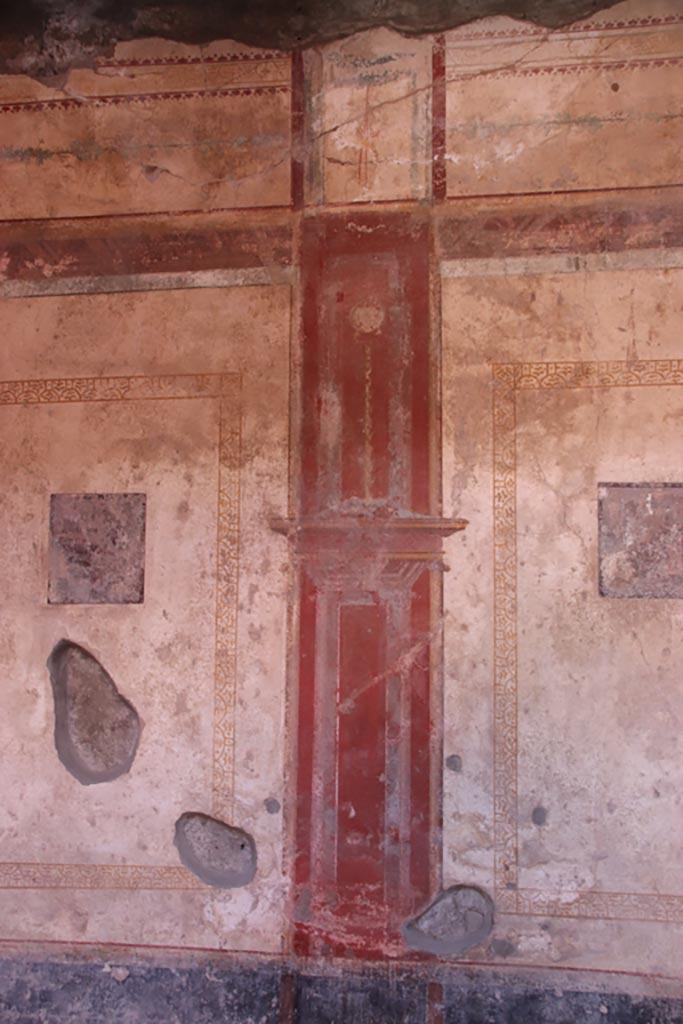 I.10.11 Pompeii. October 2022. 
Room 6, central red compartment on the south wall. Photo courtesy of Klaus Heese. 
