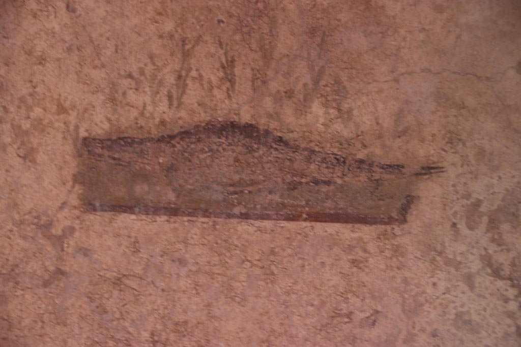 I.10.11 Pompeii. October 2022. 
Room 7, painting of a crocodile from the north end of the west wall of cubiculum. Photo courtesy of Klaus Heese. 
