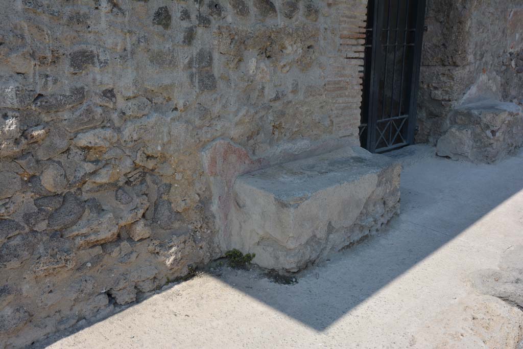 I.10.18 Pompeii. May 2017. Looking west to entrance doorway. Photo courtesy of Buzz Ferebee.
According to NdS 
The entrance to this modest house had a lava threshold framed between a brick door-jamb and one of limestone blocks, with the walls of the high zoccolo of red plaster and with a white upper part, in which stood out lively inscriptions, simple and unpretentious, on the other end of the two masonry benches that stand to the right and to the left of the entrance.
See Notizie degli Scavi di Antichit, 1934, p.341
