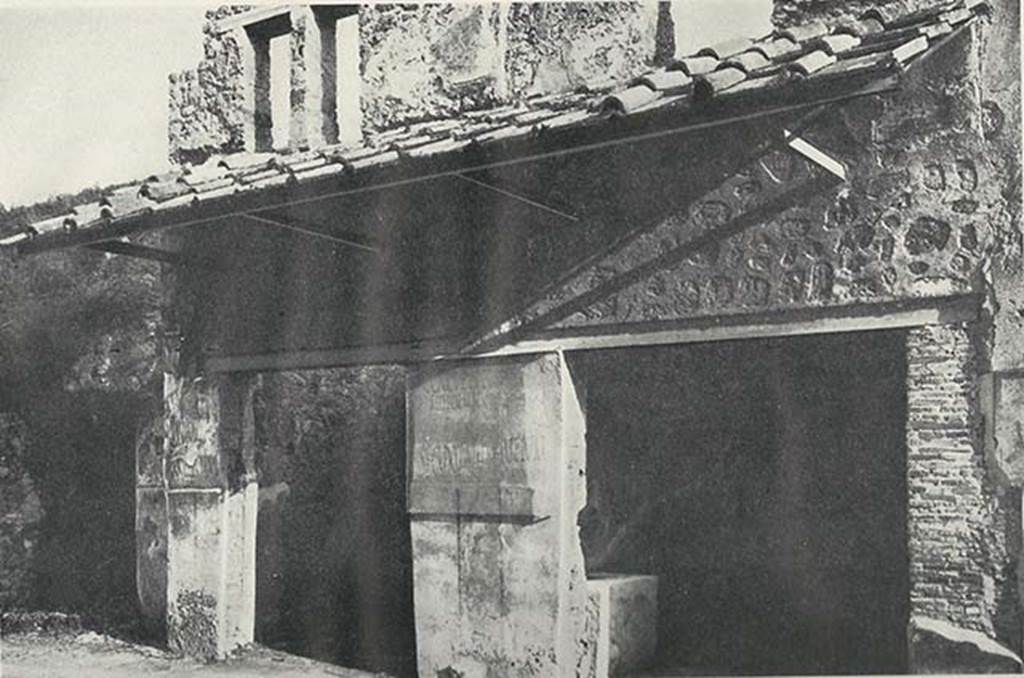I.11.2 Pompeii, on right. c.1920. Entrance doorways, with entrance doorway to I.11.3, on left. 
The painted electoral programmata are on the pillar between the doorways.
