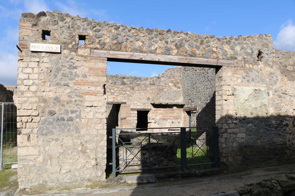 I.11.11 Pompeii. December 2018. Looking north to entrance doorway, with bar-counter. Photo courtesy of Aude Durand.
