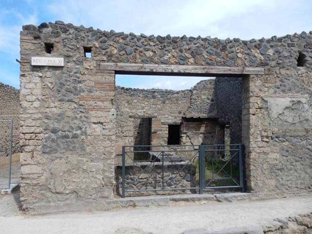 I.11.11 Pompeii. May 2017. Looking north to entrance doorway, with bar-counter.
Photo courtesy of Buzz Ferebee.
