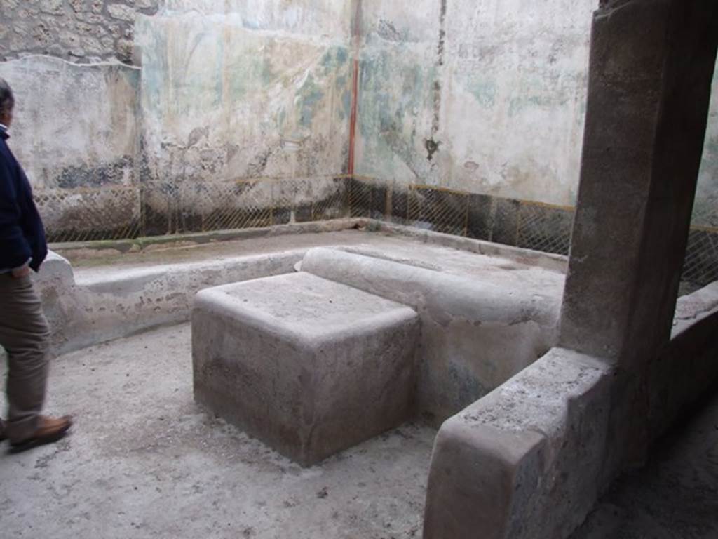 I.11.16 Pompeii. December 2007. Room 6, Looking north-east across triclinium.
On the right of the photo is the low wall (or pluteus) separating the outdoor triclinium from the passagway, room 9. According to Packer, the wall was 0.62m high. A heap of empty amphorae, stacked so that the mouths of those above enclosed the pointed end of those below, were found on the north-east corner of the triclinium, see Packer fig. 11 on page 21). Packer included the note: “This room was being excavated on July 21 1960, according to RDP.  Some of the more important items found were: a fragmentary bronze patera, a broken bronze oinochoe with a trilobate mouth, three terracotta lamps and one of glass.
See Packer, J: Inns at Pompeii: a short survey, in Cronache Pompeiane IV-1978 (p.18-24, with note on page 21)
