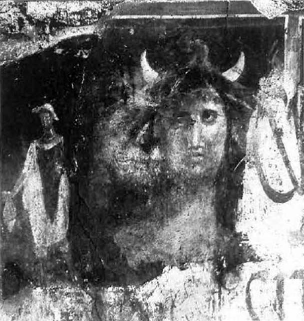 I.12.5 Pompeii. December 2006. Painted wall plaster between two doorways.     I.12.4
High up near the architrave, on the west side (right) of the doorway of I.12.5, a large painted head was found.
This showed the personification of Alessandria, or of Egypt.
On the left side of the large painted head was a painted Mercury,
Many graffiti were recorded from the walls between I.12.5 and I.12.4.
See Notizie degli Scavi di Antichità, 1914, (p.181-2)
See Varone, A. and Stefani, G., 2009. Titulorum Pictorum Pompeianorum, Rome: L’erma di Bretschneider. (p.154-5)

