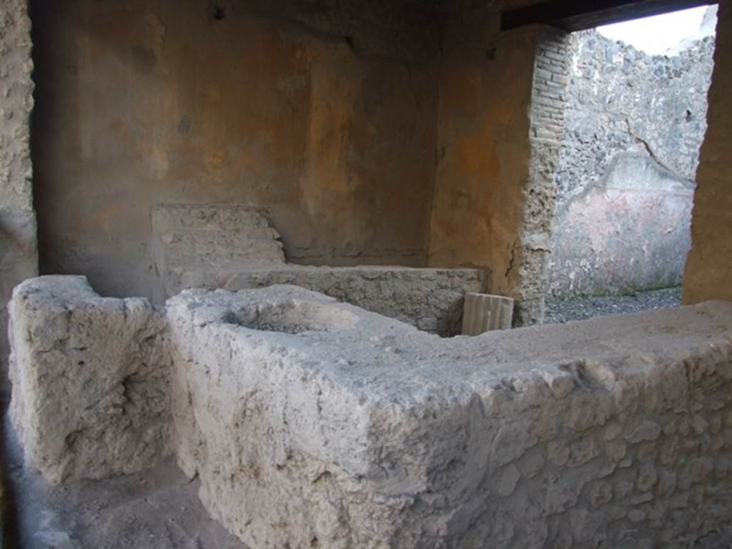 I.12.5 Pompeii. September 2015. Looking south along counter, towards hearth at far end.