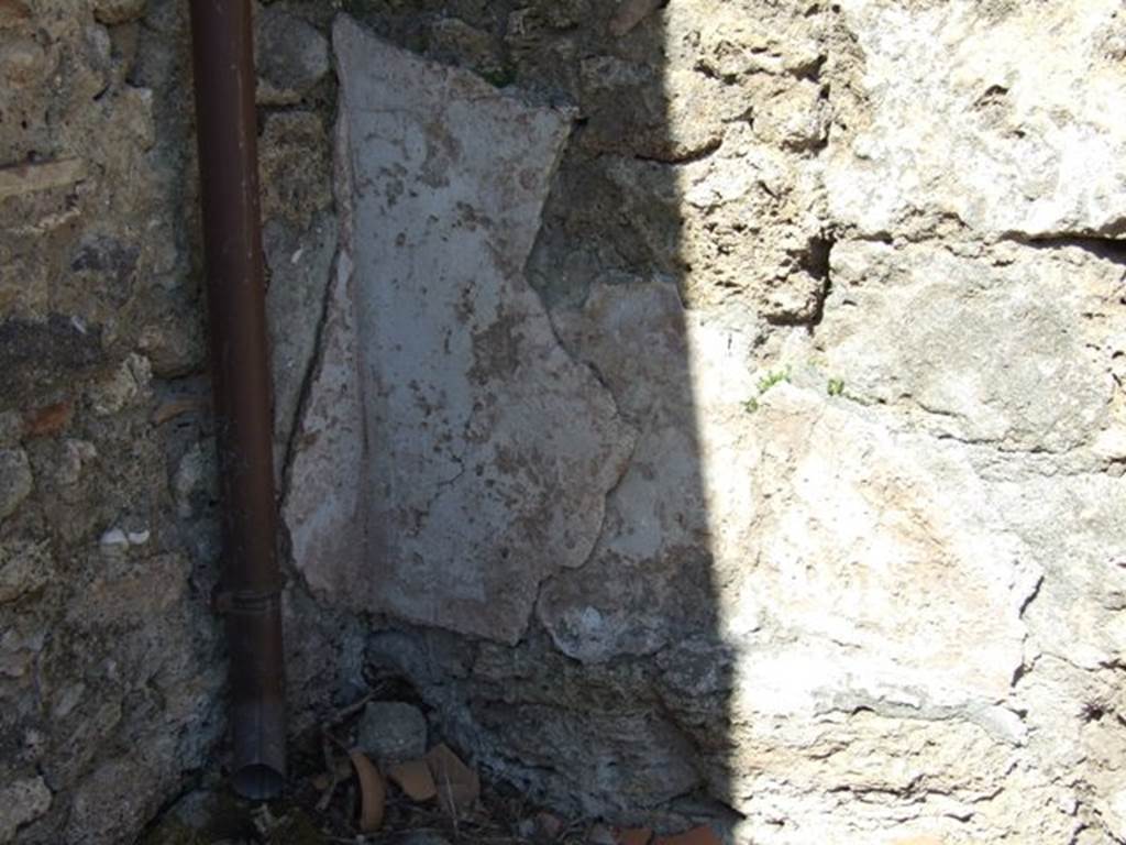 I.12.8 Pompeii. March 2009. Room 13, north-west corner of rear garden, with remains of wall plaster.