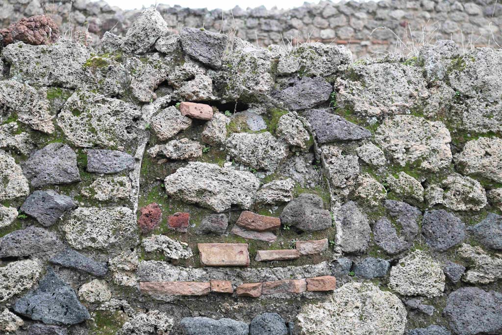 I.12.8 Pompeii. December 2018. Room 5, detail of bricked-in niche in east wall. Photo courtesy of Aude Durand.
