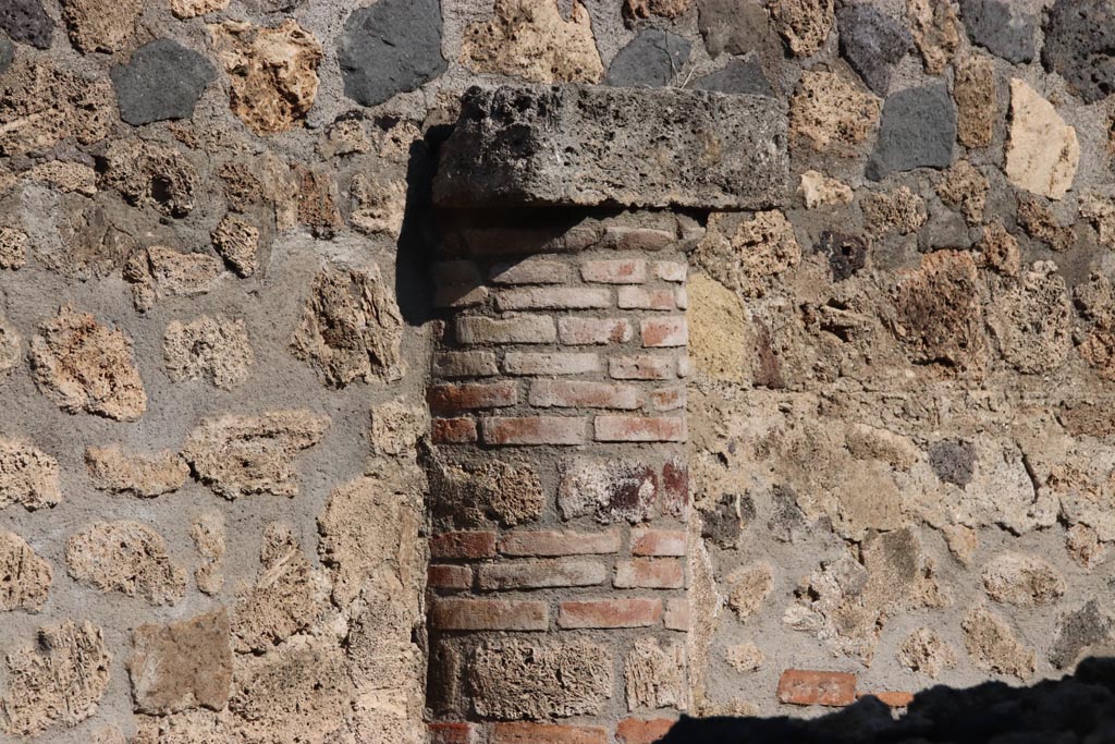 I.14.11 Pompeii. October 2022. Detail of semi-column embedded into north wall. Photo courtesy of Klaus Heese.