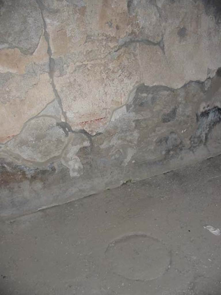 I.14.15 Pompeii. May 2003. 
Detail of north wall and floor of rear room behind counter. Photo courtesy of Nicolas Monteix.

