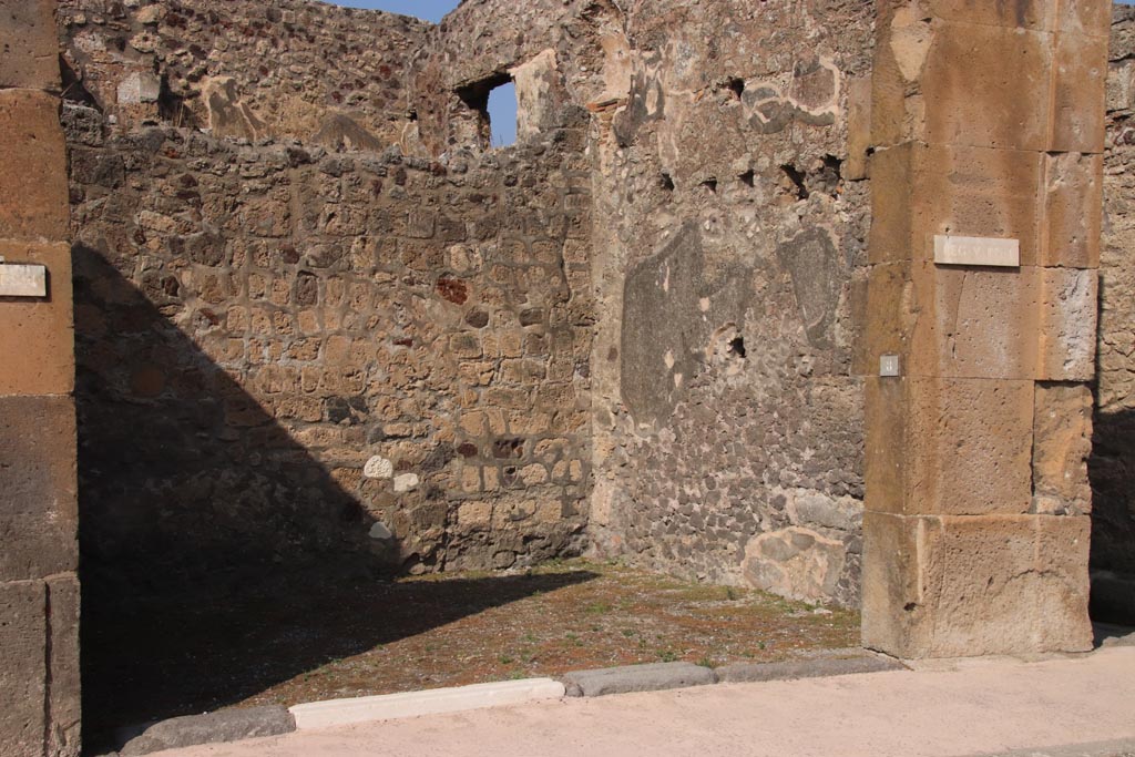 V.1.8 Pompeii. October 2023. Entrance doorway on north side of Via di Nola. Photo courtesy of Klaus Heese.