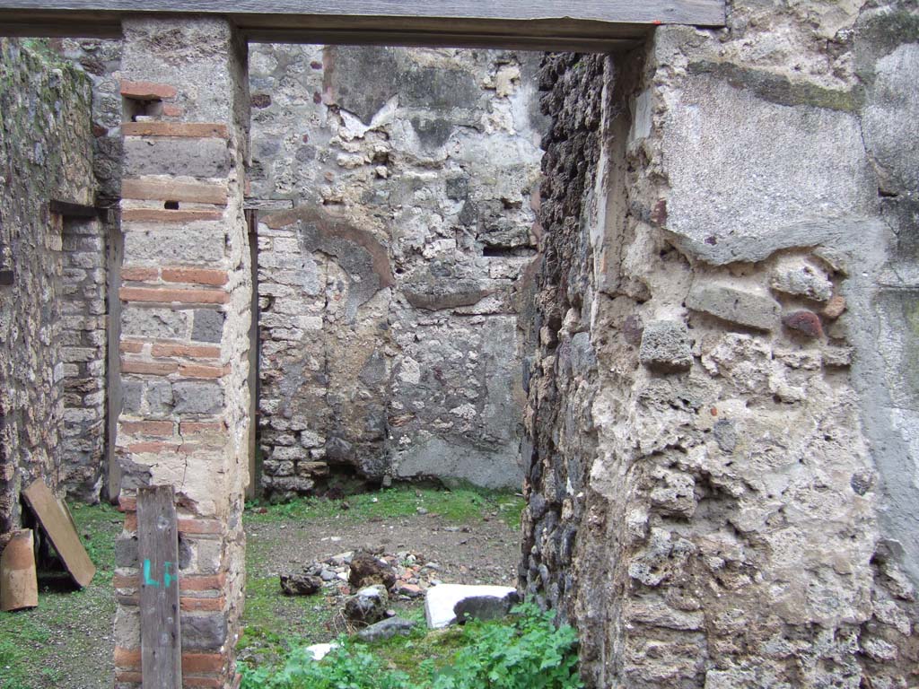 V.1.12 Pompeii. December 2005. Entrance for steps to upper floor above this services’ area. 
Also on the upper floor was an another latrine, above the one below in the room next to the kitchen.
