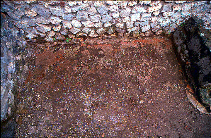 V.1.15 Pompeii. July 2008. South-west corner of atrium, with doorway to V.1.16, centre, and entrance corridor, on right. Photo courtesy of Jared Benton.
