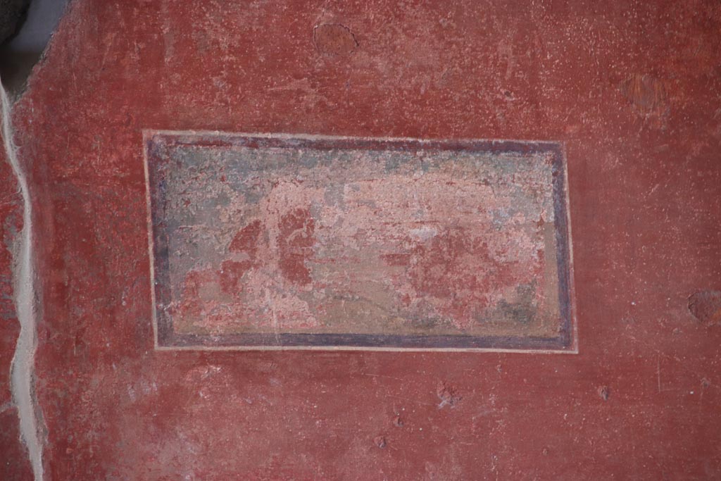 V.2.i Pompeii.  October 2023. Tablinum 7, detail of painted panel on east wall at north end. Photo courtesy of Klaus Heese.