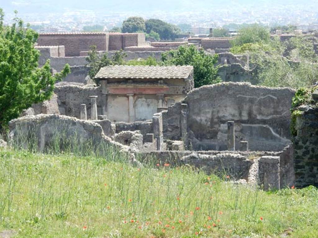 VI.5.21 Pompeii. May 2015. Looking south across VI.5.22, and rear of VI.5.4 taken from the city walls. Photo courtesy of Buzz Ferebee.
