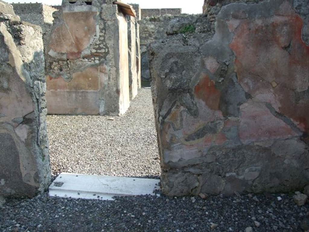 VI.7.6 Pompeii. March 2009. Room 10, south wall of triclinium, with leaning west side. Looking south.
The walls of this triclinium would have been painted with a high zoccolo painted in black panels separated by compartments. 
The middle zone of the walls would have had red and yellow panels separated by architectural details in IVth Style.



