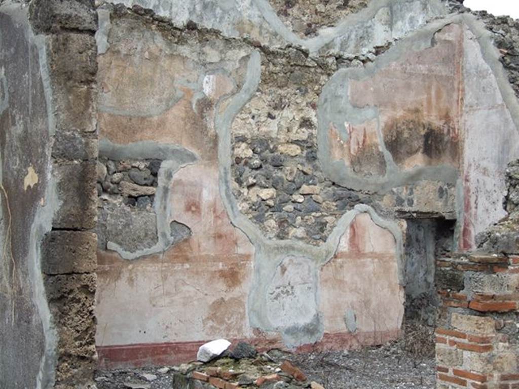 VI.7.19 Pompeii. December 2006. Detail of remains of painted north wall in oecus to north of tablinum.